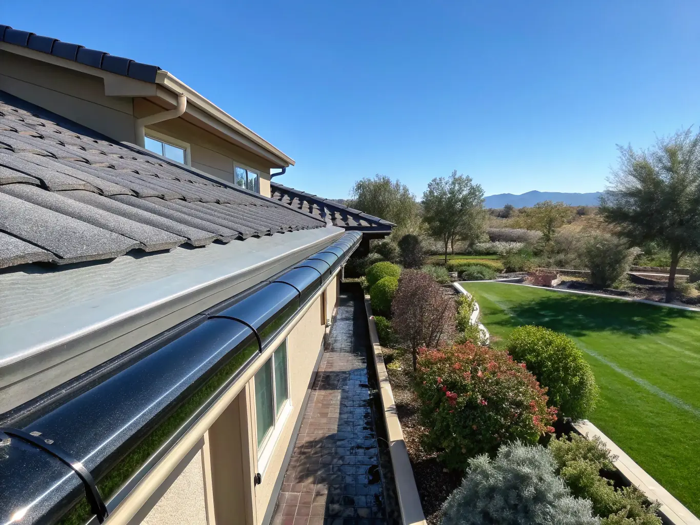 A close-up of clean gutters, free from leaves and debris, ensuring proper water drainage and preventing potential water damage to a home in Folsom.